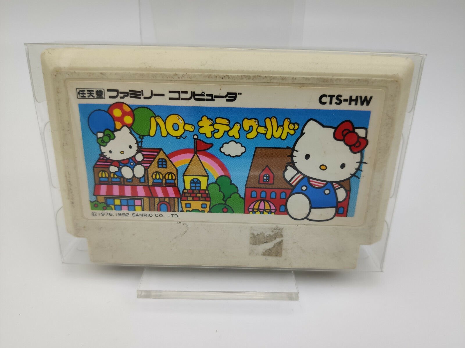 HELLO KITTY WORLD + PLASTIC SHELL FAMICOM USED